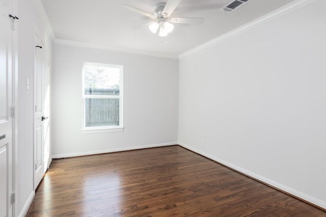 spare room featuring crown molding, ceiling fan, and dark hardwood / wood-style floors