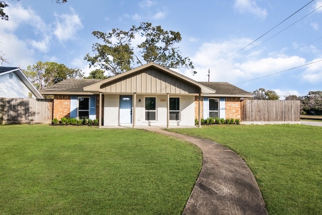 ranch-style home featuring a front yard