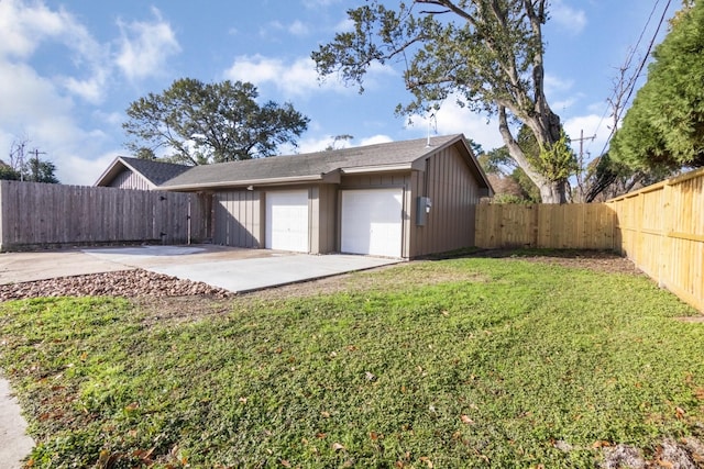 garage featuring a lawn