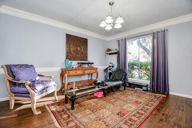 sitting room with crown molding, dark hardwood / wood-style flooring, a chandelier, and a textured ceiling