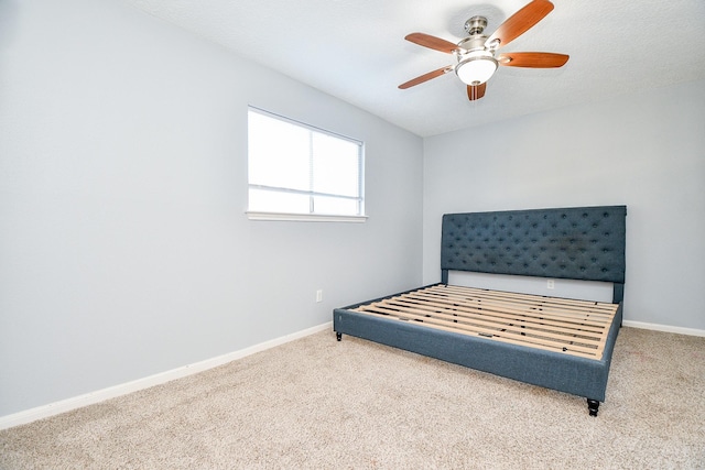 bedroom with ceiling fan and carpet floors