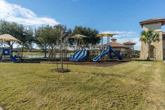 community play area featuring a yard and a water view