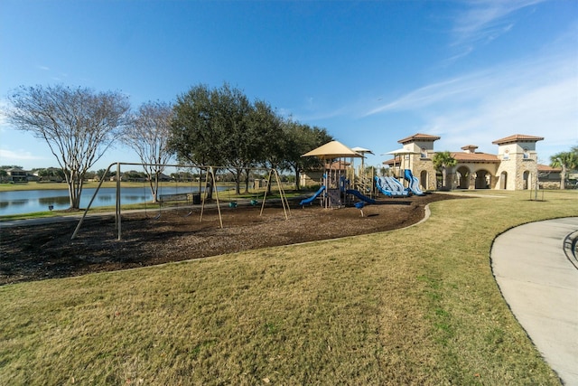 communal playground with a water view and a lawn