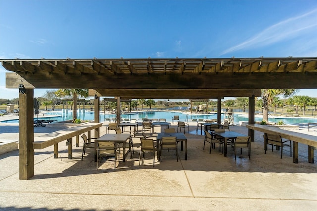 surrounding community featuring a swimming pool and a pergola