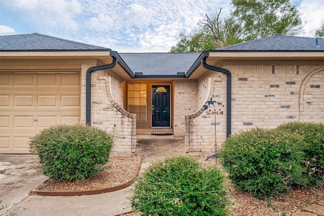 view of exterior entry featuring a garage