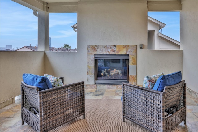 view of patio featuring a tiled fireplace