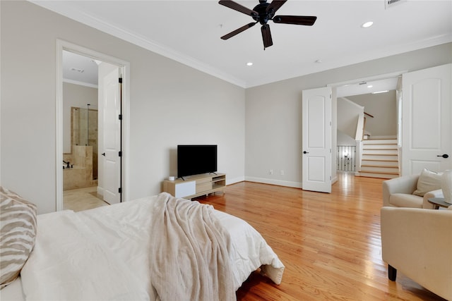 bedroom with ensuite bathroom, ceiling fan, light wood-type flooring, and crown molding