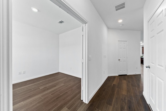 hallway featuring dark wood-type flooring