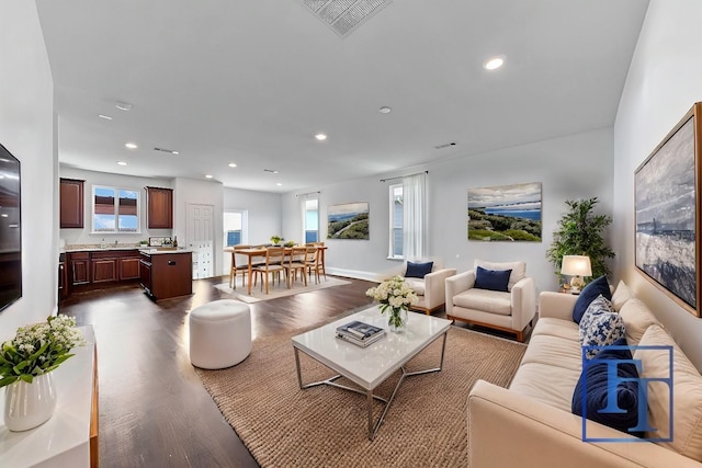 living room featuring dark hardwood / wood-style flooring