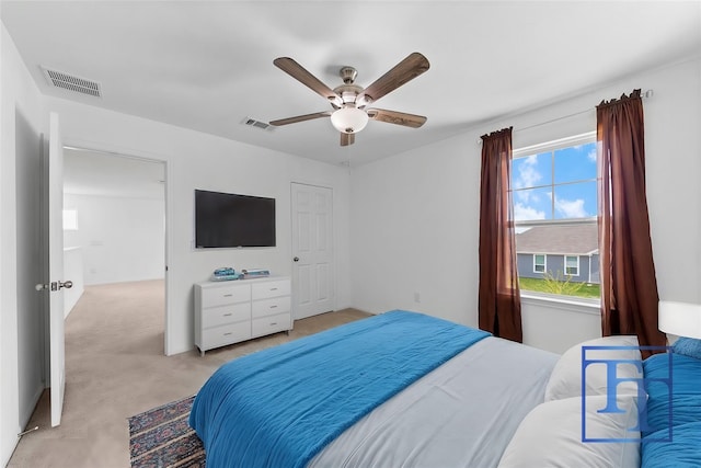 bedroom with light carpet and ceiling fan