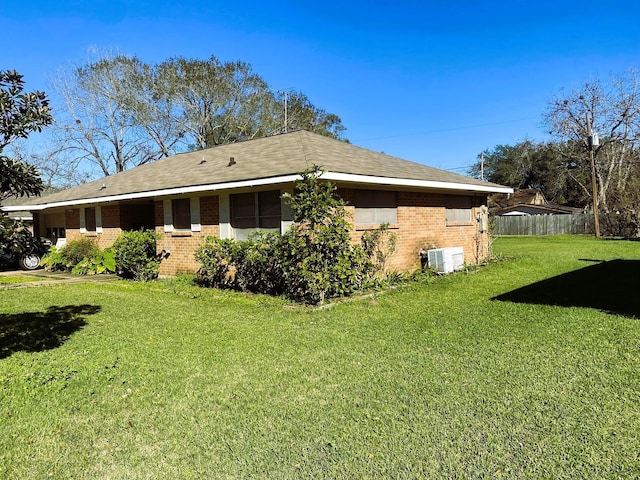 view of home's exterior with a lawn