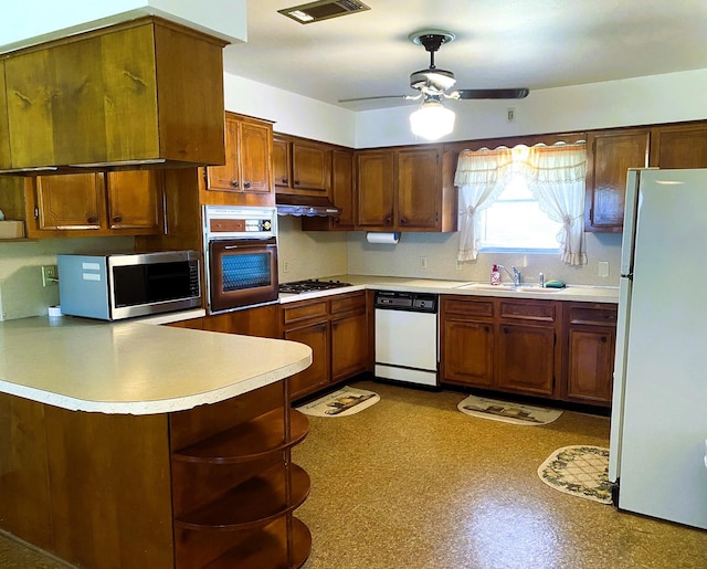 kitchen featuring stainless steel appliances, sink, ventilation hood, kitchen peninsula, and ceiling fan