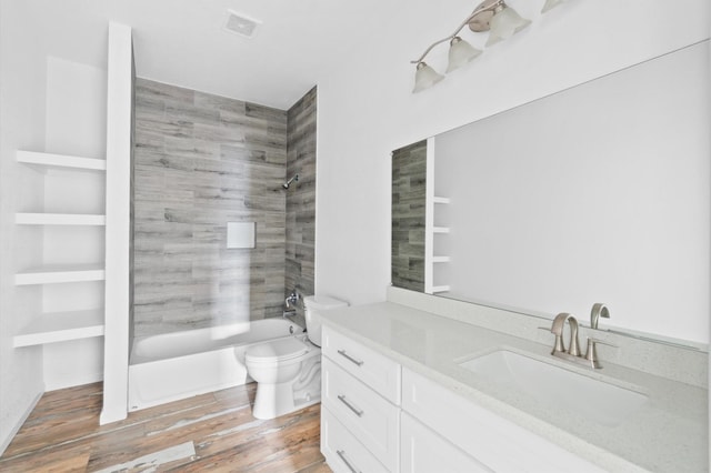 full bathroom with toilet, vanity, bathing tub / shower combination, and hardwood / wood-style flooring