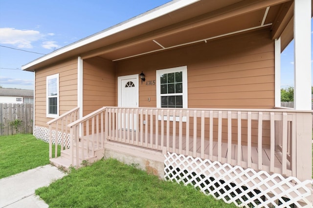 property entrance featuring a yard