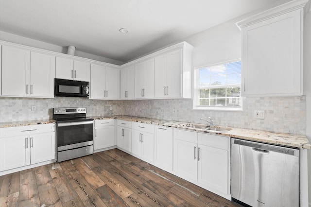 kitchen with stainless steel appliances, dark hardwood / wood-style flooring, white cabinets, and sink