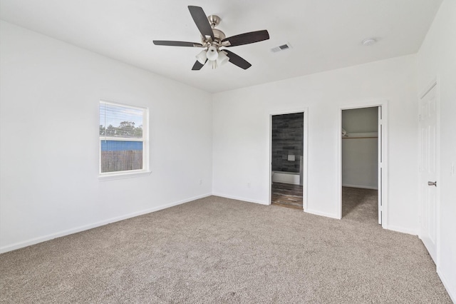 unfurnished bedroom featuring ceiling fan and light carpet