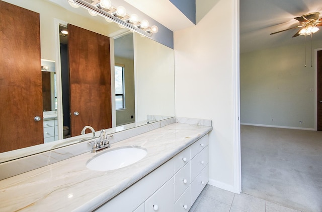 bathroom featuring ceiling fan, tile patterned floors, vanity, and toilet