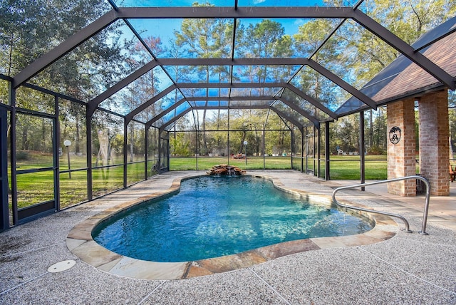 view of swimming pool with a lanai, a patio area, and a yard