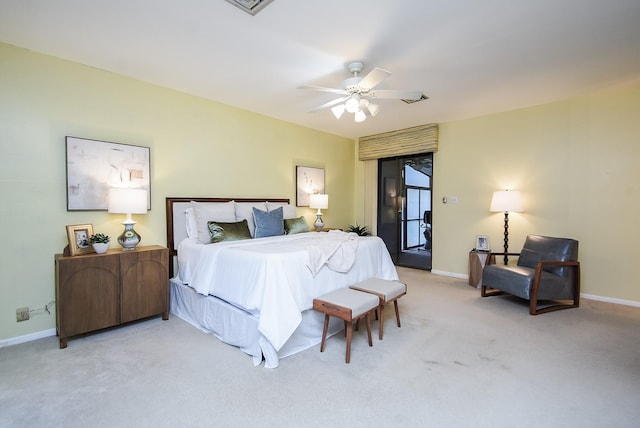 bedroom featuring ceiling fan and light carpet