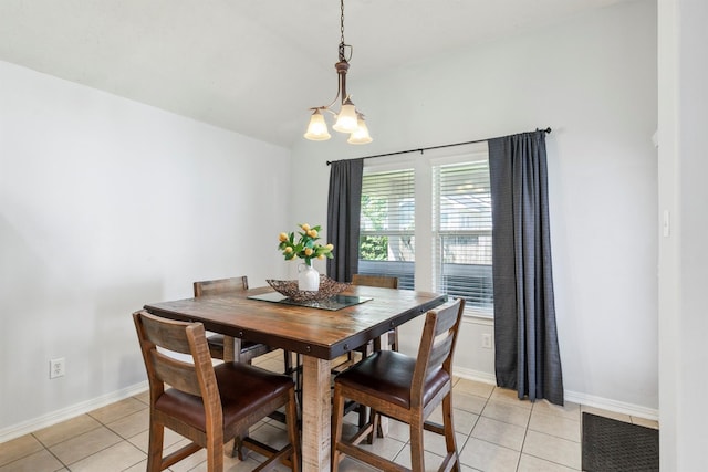 16407 Jadestone Terrace Ln, Houston, TX 77044 - dining area featuring light tile patterned flooring, a chandelier, baseboards, and lofted ceiling