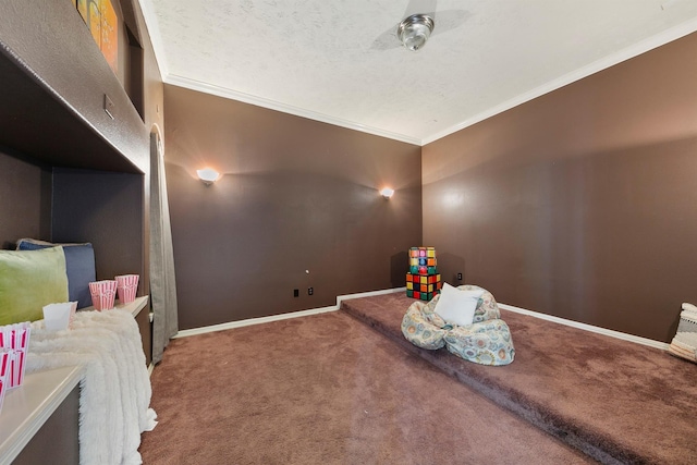 carpeted cinema with a textured ceiling and ornamental molding