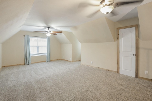 bonus room featuring ceiling fan, light colored carpet, and vaulted ceiling