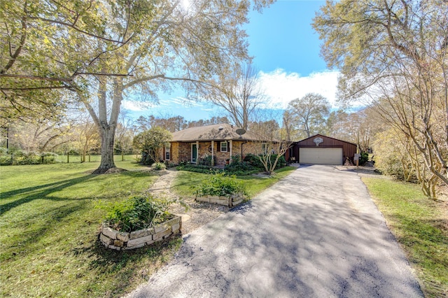 single story home with a garage and a front yard