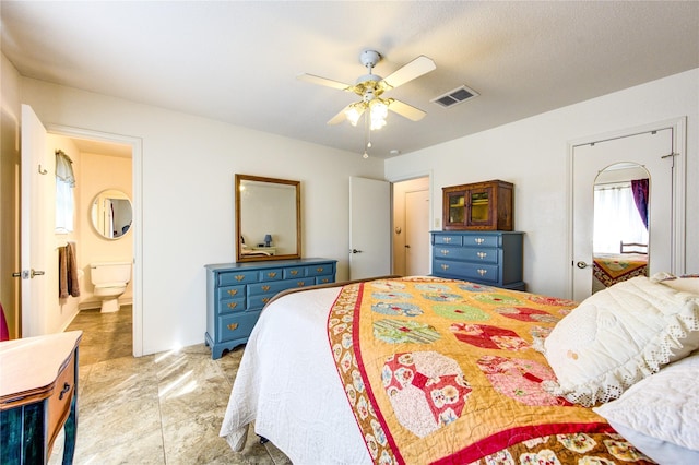 bedroom featuring ceiling fan and ensuite bathroom