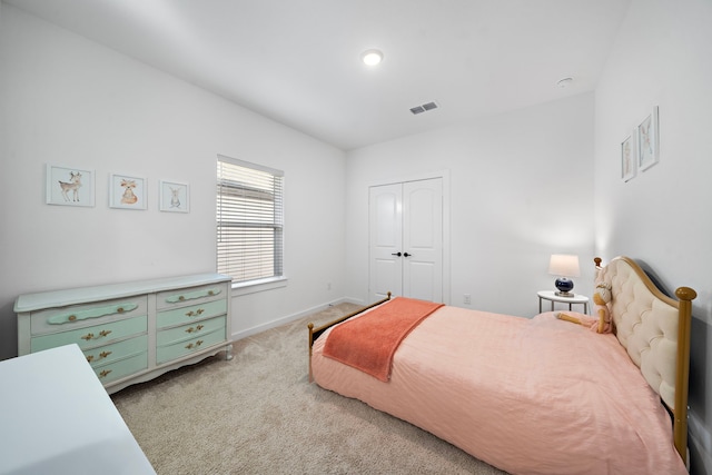 carpeted bedroom featuring a closet