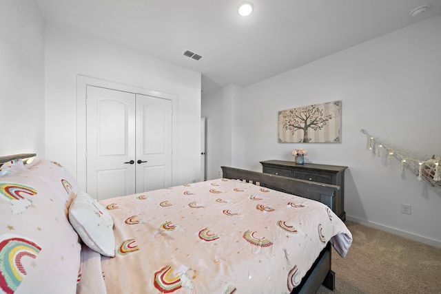 carpeted bedroom featuring a closet