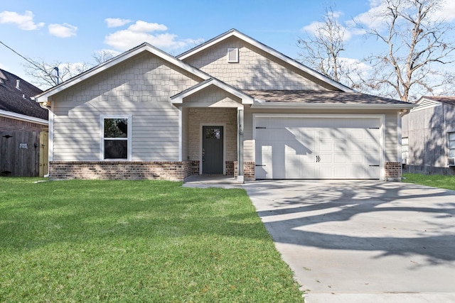 view of front of property featuring a front yard and a garage