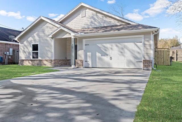 view of front facade with a garage and a front yard