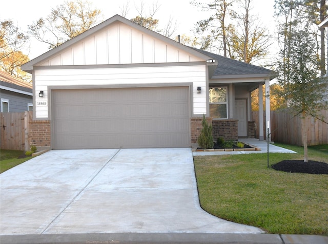 view of front facade with a front lawn and a garage