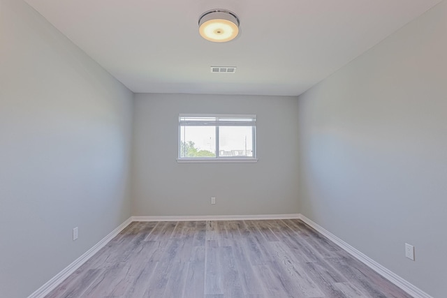 unfurnished room featuring light wood-type flooring