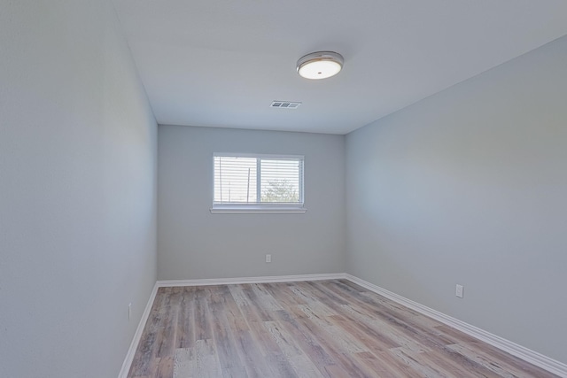 unfurnished room with light hardwood / wood-style flooring