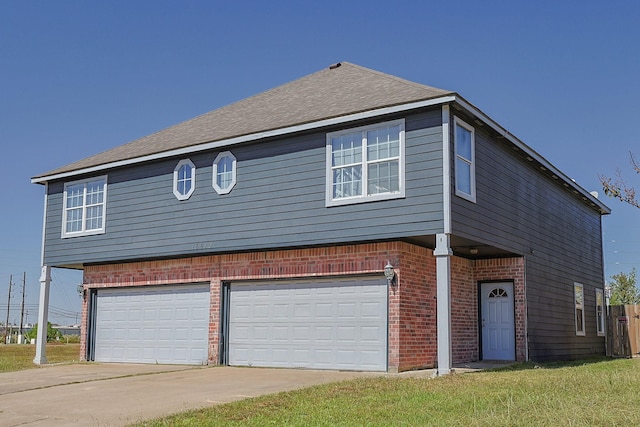 view of front property featuring a front yard and a garage