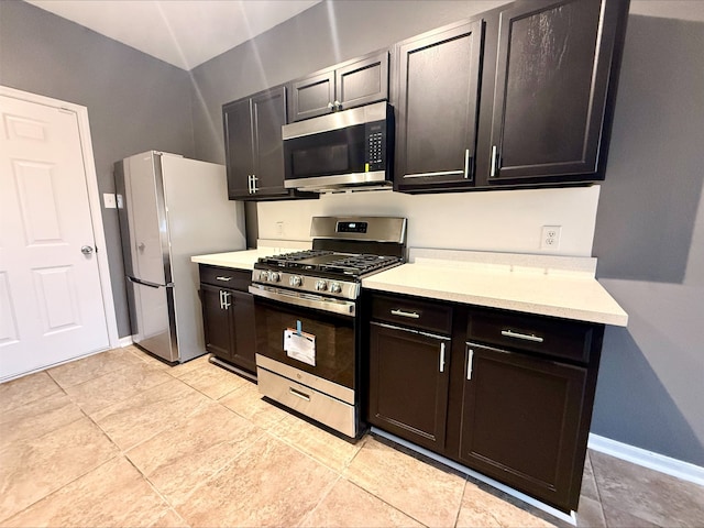 kitchen with light tile patterned floors and appliances with stainless steel finishes