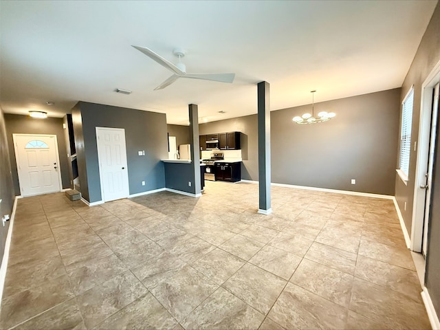 unfurnished living room with ceiling fan with notable chandelier