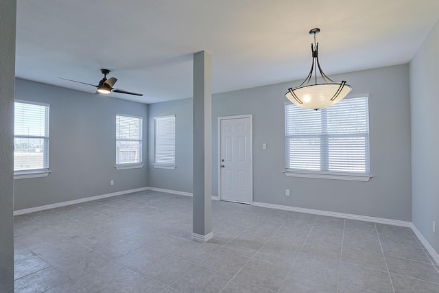 empty room featuring ceiling fan and light tile patterned floors