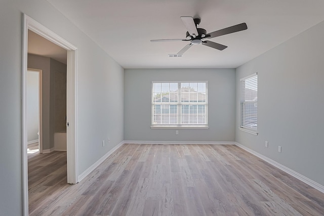 spare room with ceiling fan and light hardwood / wood-style flooring