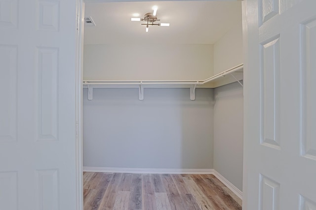 walk in closet featuring light wood-type flooring