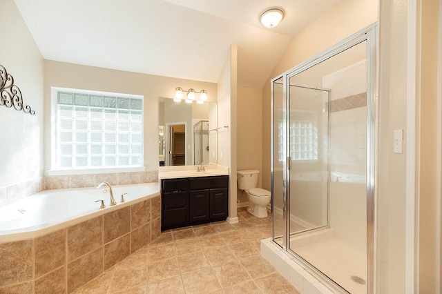 full bathroom with toilet, vanity, lofted ceiling, and independent shower and bath