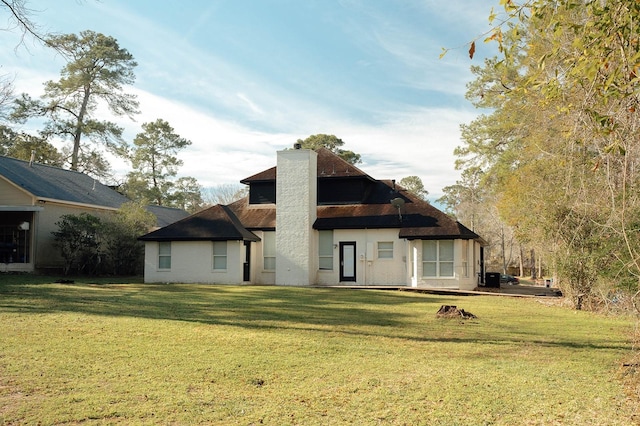 27210 Afton Way, Huffman, TX 77336 - back of house with a chimney and a yard