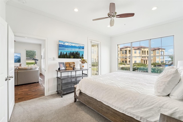 bedroom featuring ceiling fan, carpet, and crown molding