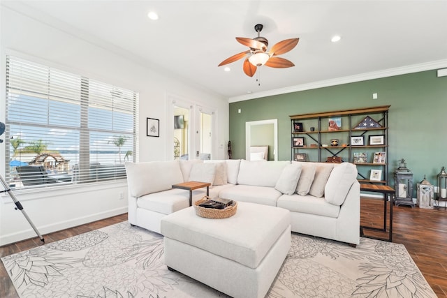 living room with ceiling fan, crown molding, and hardwood / wood-style flooring