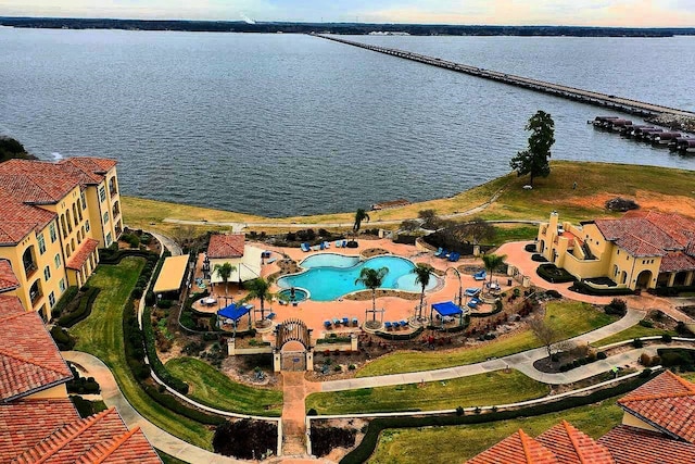 birds eye view of property with a water view