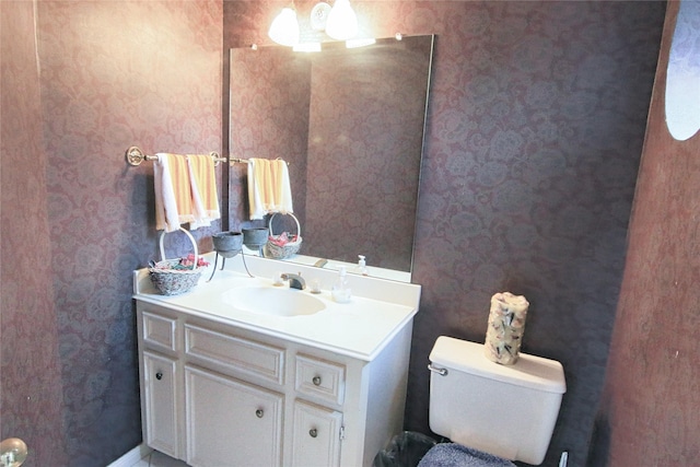 bathroom with toilet and vanity