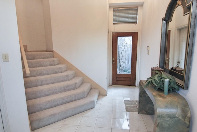 foyer entrance with light tile patterned flooring