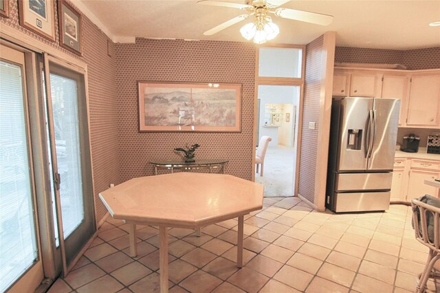 kitchen featuring ceiling fan, white cabinets, light tile patterned floors, and stainless steel fridge with ice dispenser