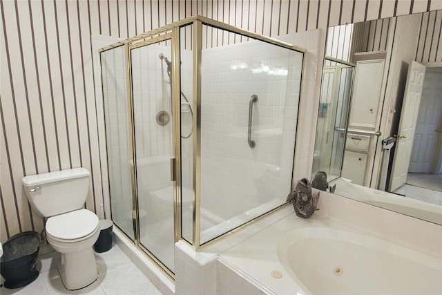 bathroom featuring tile patterned floors, toilet, and separate shower and tub